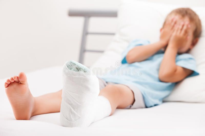 Child with leg cast recovering from growth plate fracture treatment